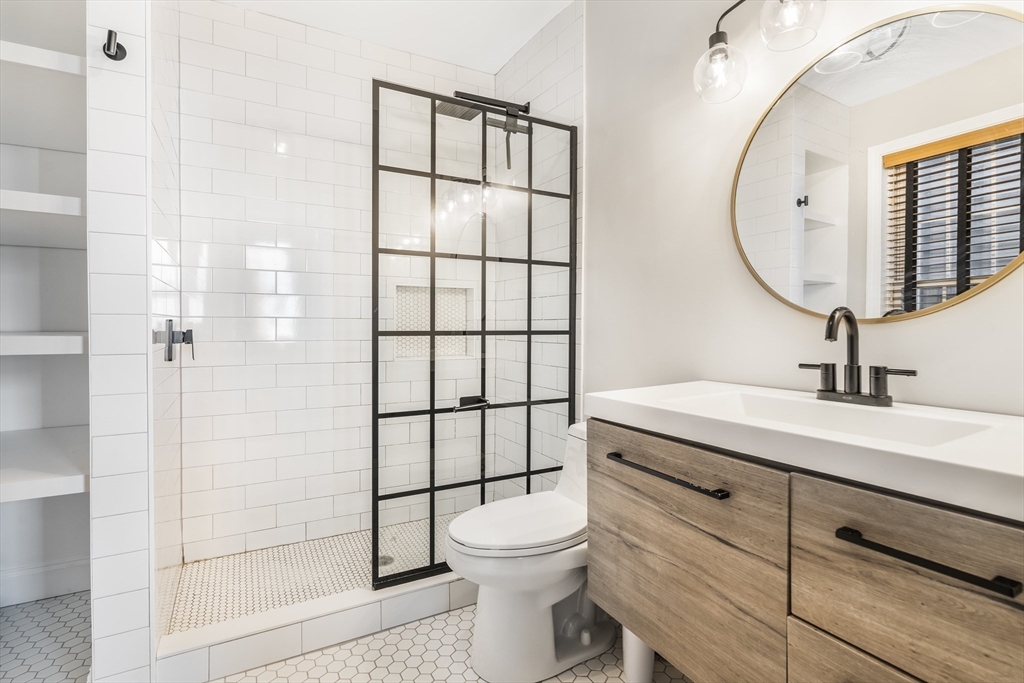 52 O Street, Unit 3 Boston, MA 02127 - Photo 13 of 20 a bathroom with a sink a toilet and shower