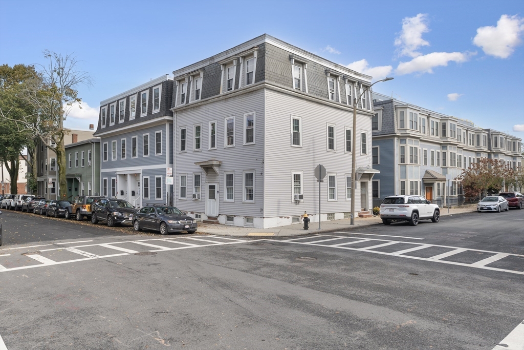 52 O Street, Unit 3 Boston, MA 02127 - Photo 17 of 20 a city street lined with parked cars and buildings