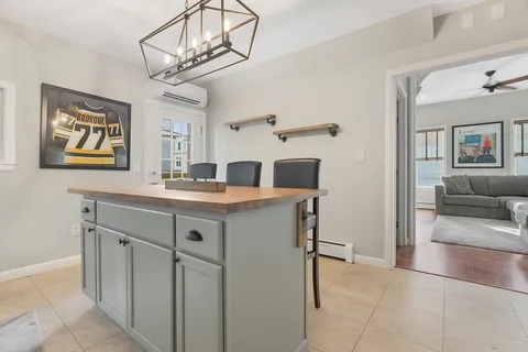 a kitchen with cabinets and window