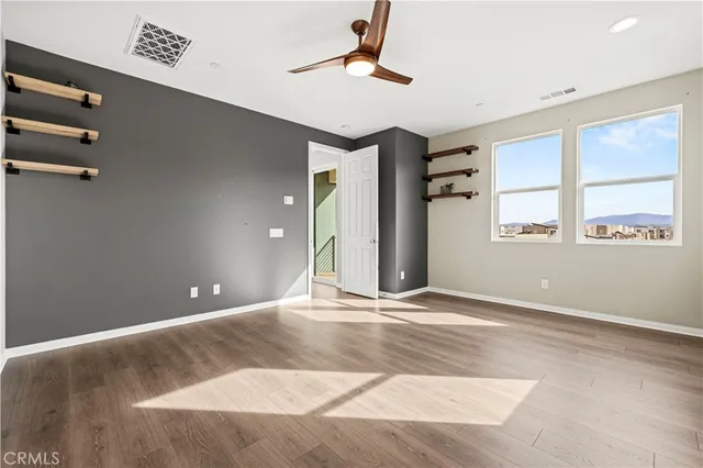 a bathroom with double sink and a mirror