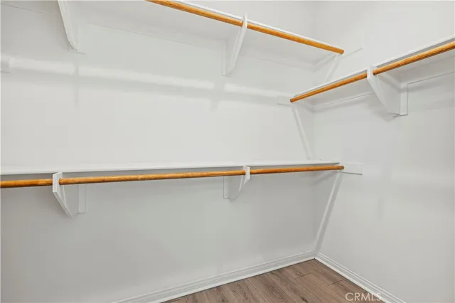 a view of a balcony with wooden floor and city view