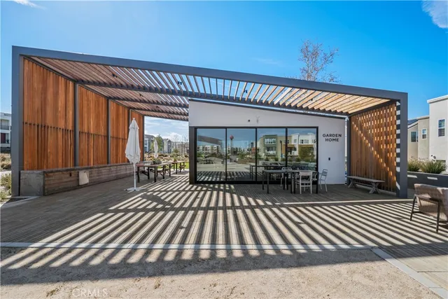 a picture of a bench in front of a wall