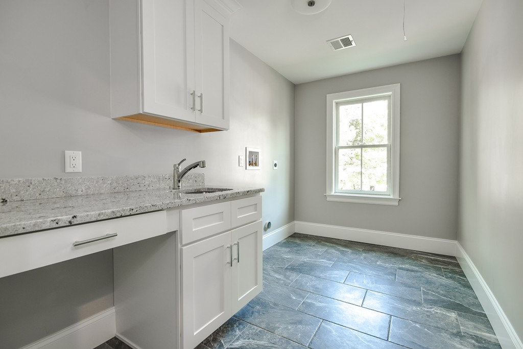 7 Bryn Mawr Road Wellesley, MA 02482 - Photo 25 of 30 a kitchen with granite countertop a sink cabinets and window