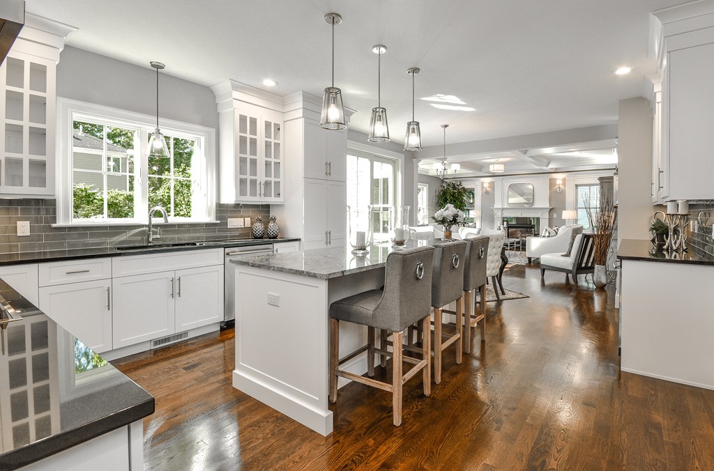 7 Bryn Mawr Road Wellesley, MA 02482 - Photo 8 of 30 a large kitchen with lots of counter space a dining table and chairs