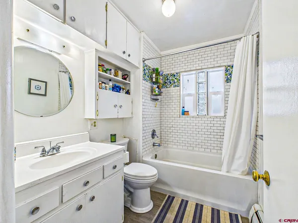 a living room with furniture and a rug