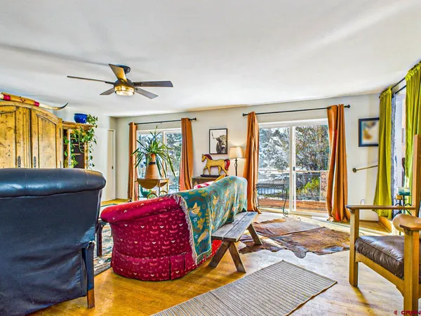 a bedroom with a bed and a bookshelf