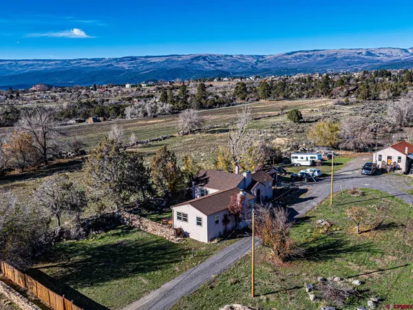 an aerial view of house with yard