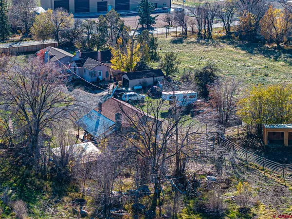 a view of a parked car in front of house