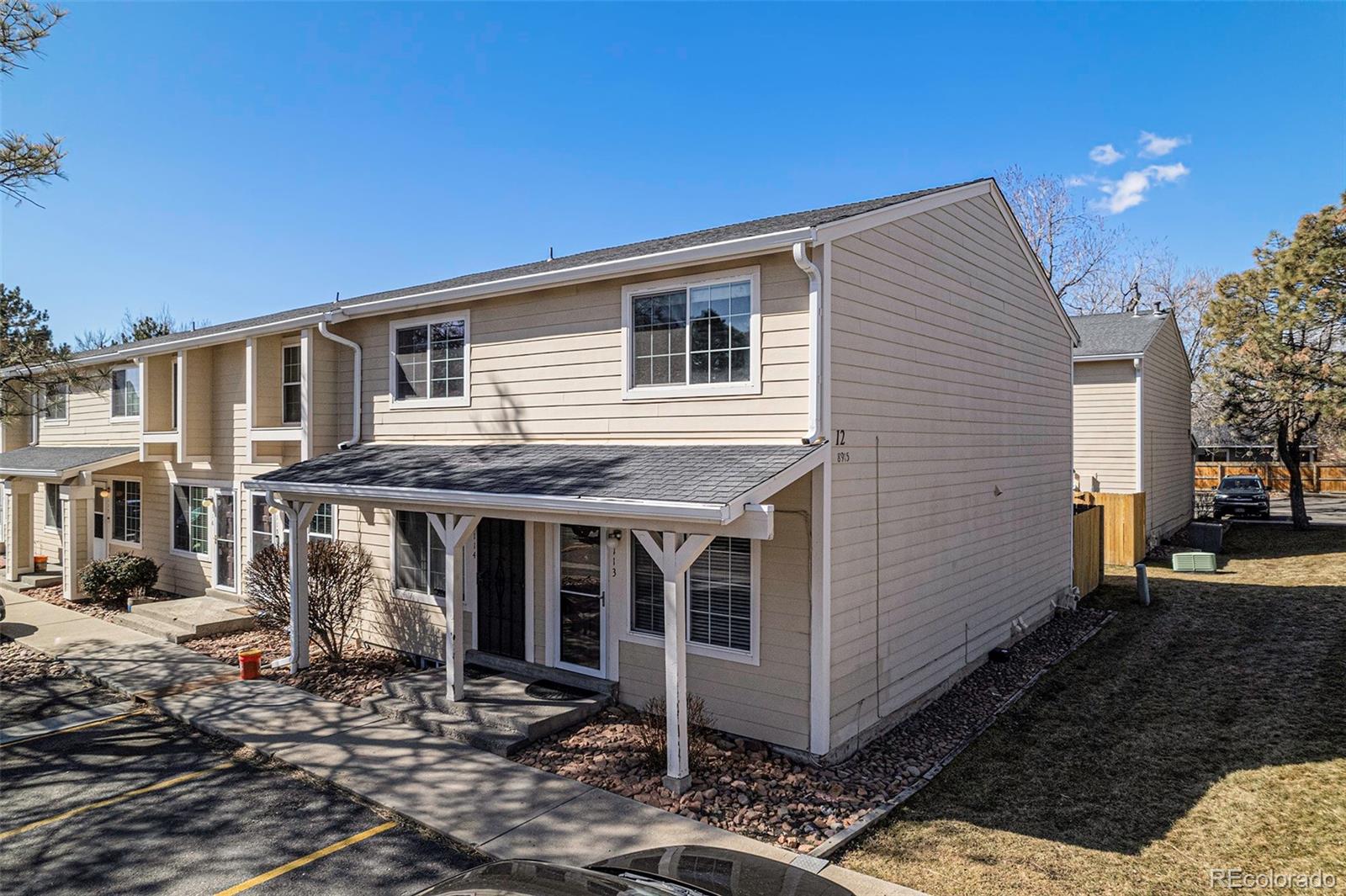 a front view of a house with parking space