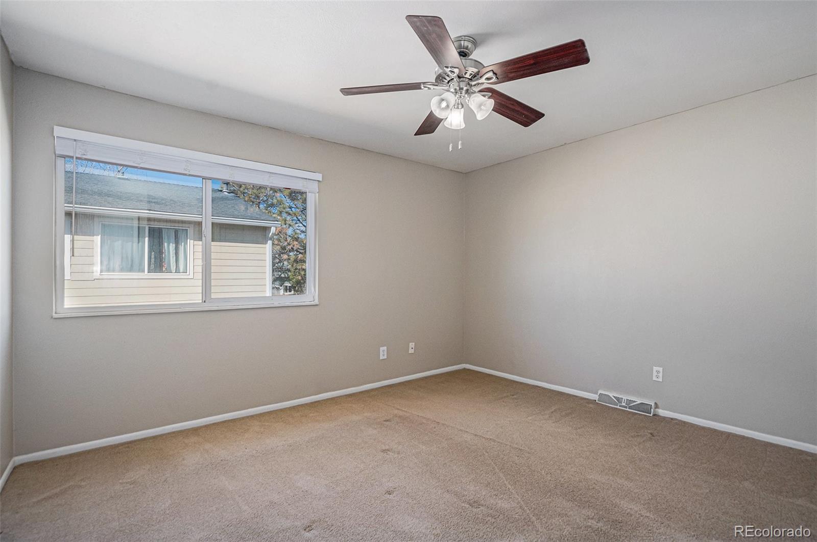 8915 Field Street, Unit 113 Westminster, CO 80021 - Photo 15 of 38 an empty room with a window