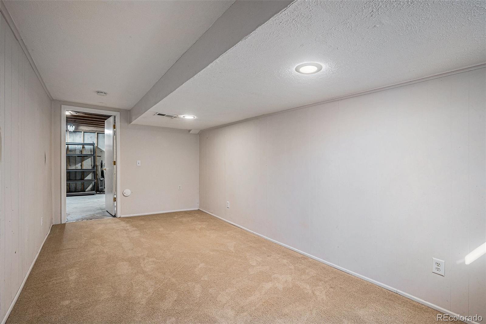 8915 Field Street, Unit 113 Westminster, CO 80021 - Photo 22 of 38 an empty room with windows
