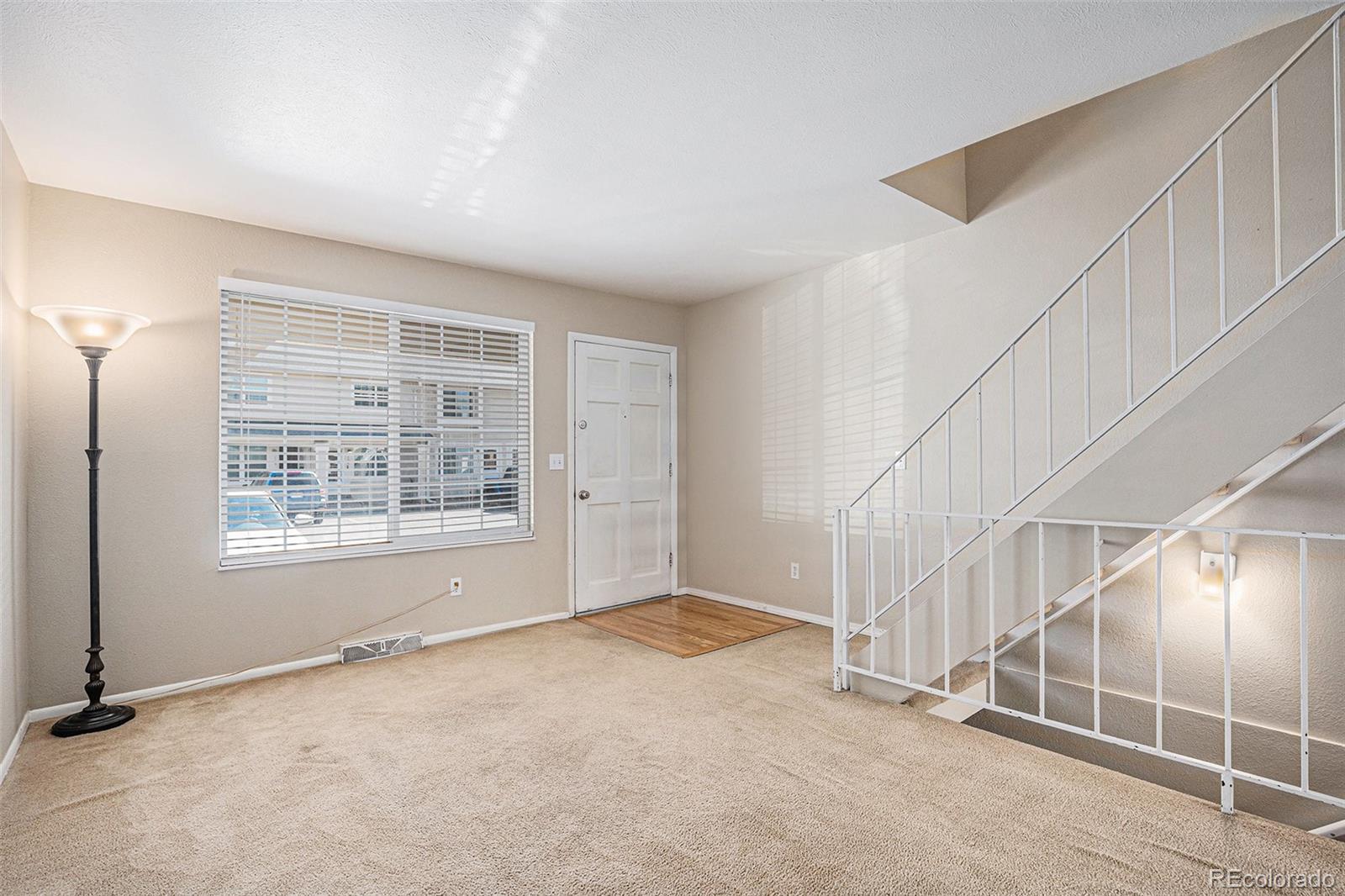 8915 Field Street, Unit 113 Westminster, CO 80021 - Photo 4 of 38 an empty room with windows