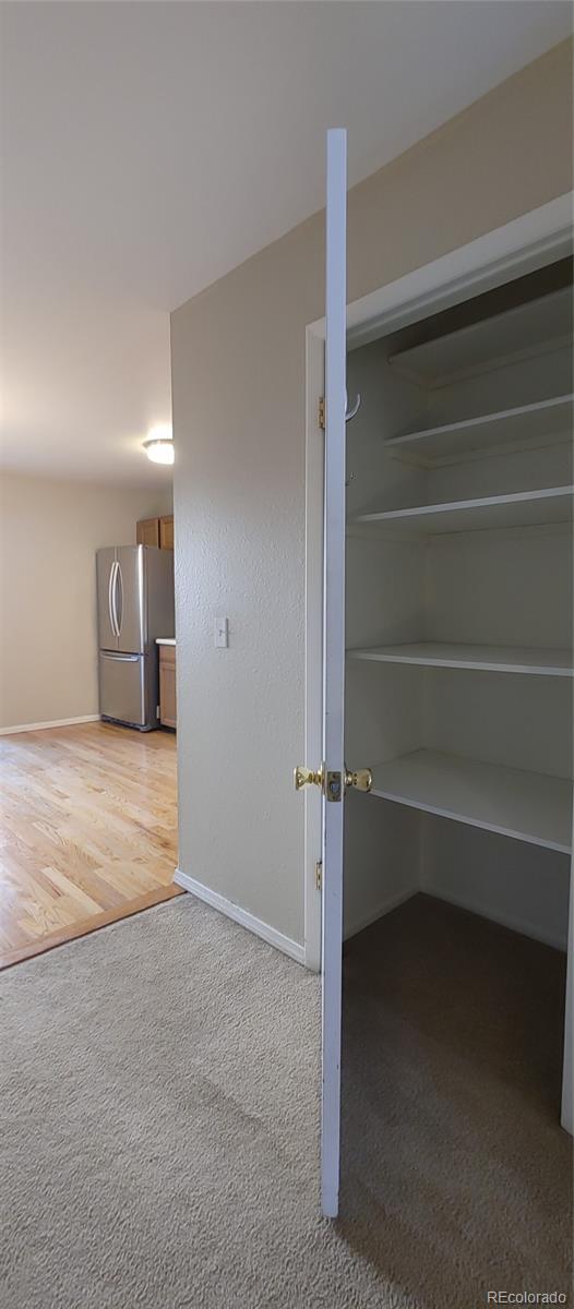 8915 Field Street, Unit 113 Westminster, CO 80021 - Photo 8 of 38 a view of an empty room with a closet