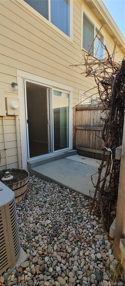 8915 Field Street, Unit 113 Westminster, CO 80021 - Photo 10 of 38 a view of a backyard with wooden fence