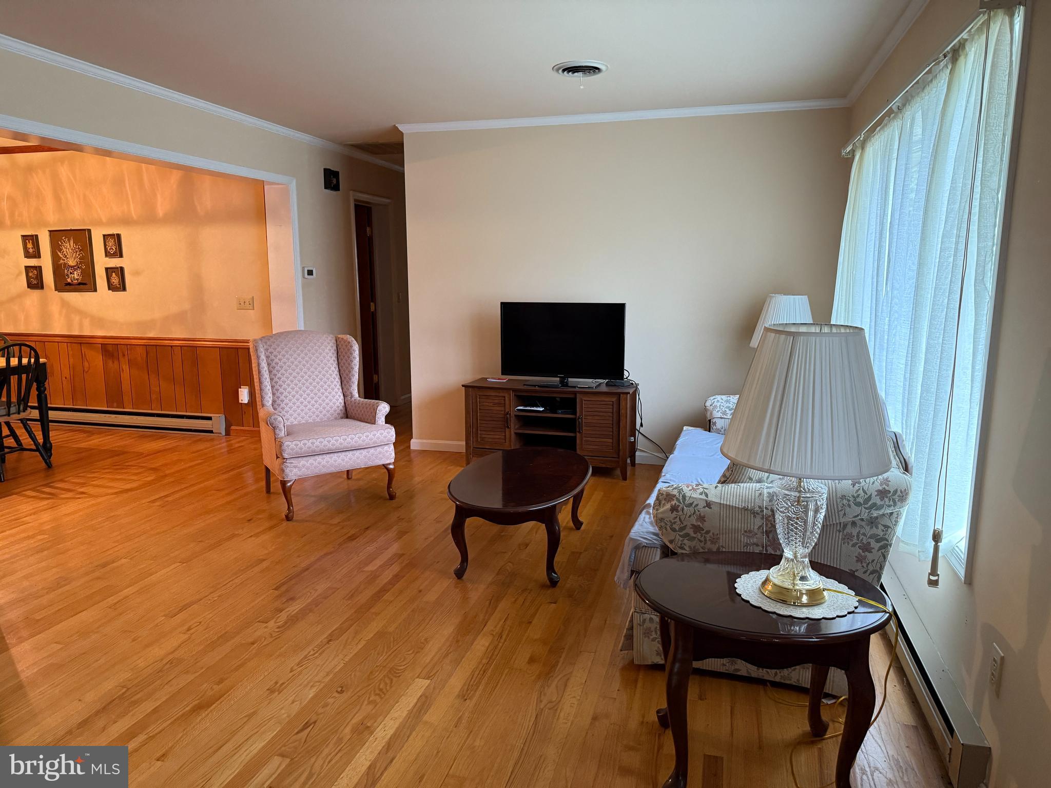 314 Kerr Avenue Denton, MD 21629 - Photo 12 of 19 a living room with furniture and a flat screen tv