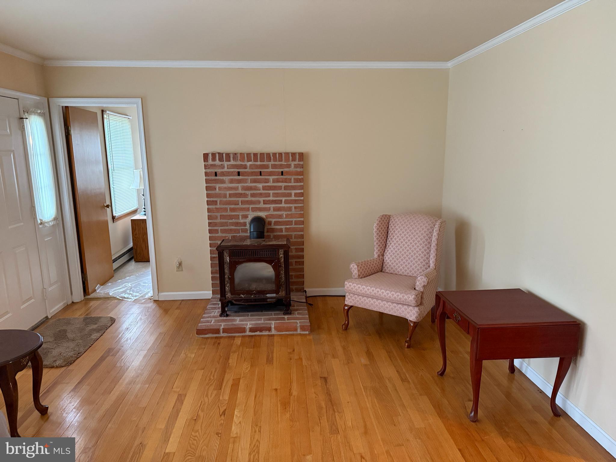 314 Kerr Avenue Denton, MD 21629 - Photo 13 of 19 a living room with furniture and a fireplace