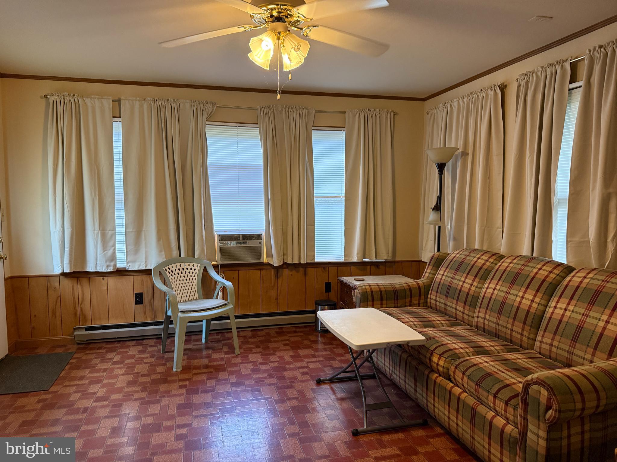 314 Kerr Avenue Denton, MD 21629 - Photo 4 of 19 a living room with furniture and a potted plant