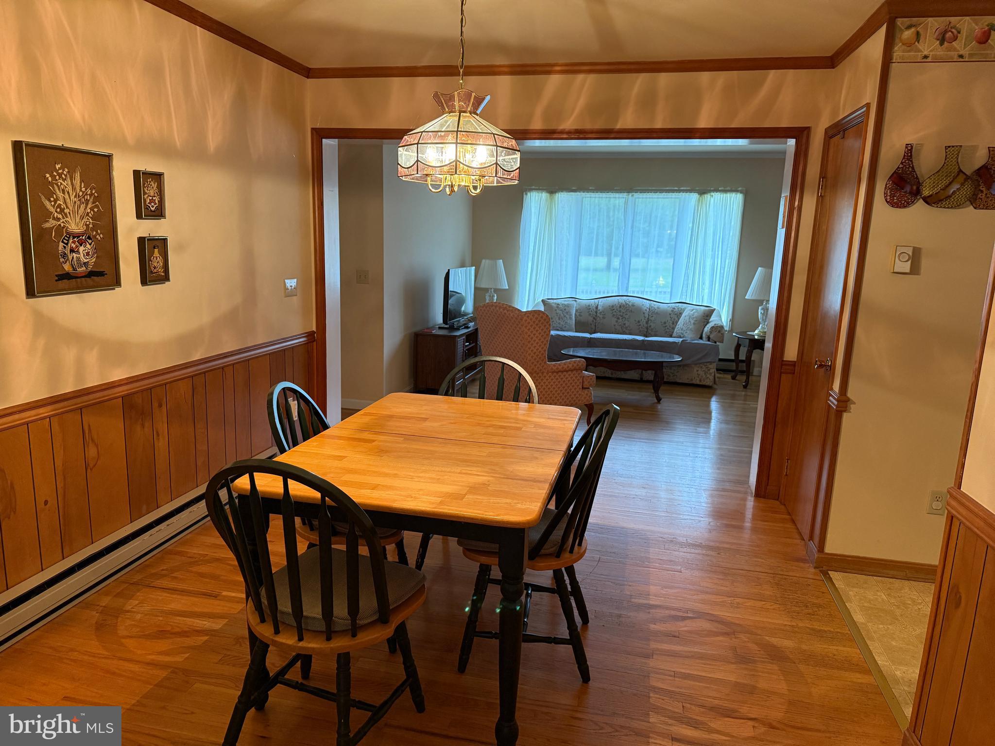 314 Kerr Avenue Denton, MD 21629 - Photo 5 of 19 a dining room with a table chairs and kitchen view