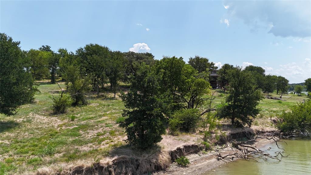 Lot 32 Opal Drive Corsicana, TX 75109 - Photo 29 of 40 a backyard of a house with a yard and lake view