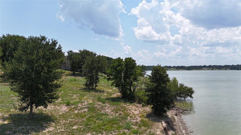 Lot 32 Opal Drive Corsicana, TX 75109 - Photo 34 of 40 a backyard of a house with lots of green space