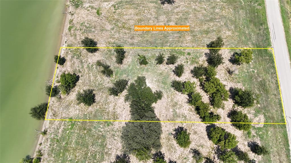 Lot 32 Opal Drive Corsicana, TX 75109 - Photo 6 of 40 a bathroom with a sink and mirror