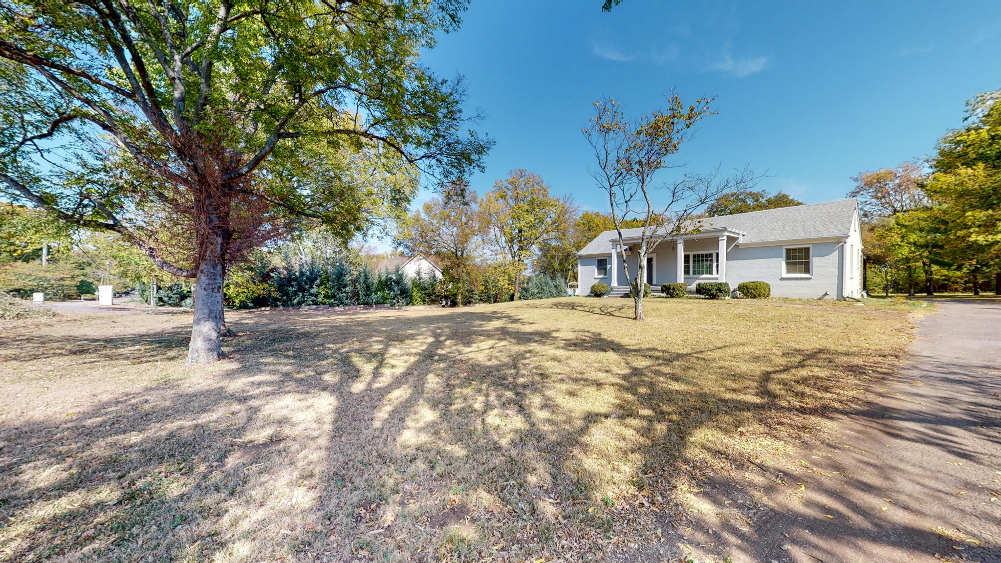 774 Elysian Fields Road Nashville, TN 37204 - Photo 11 of 43 a view of a white house with a yard covered with snow