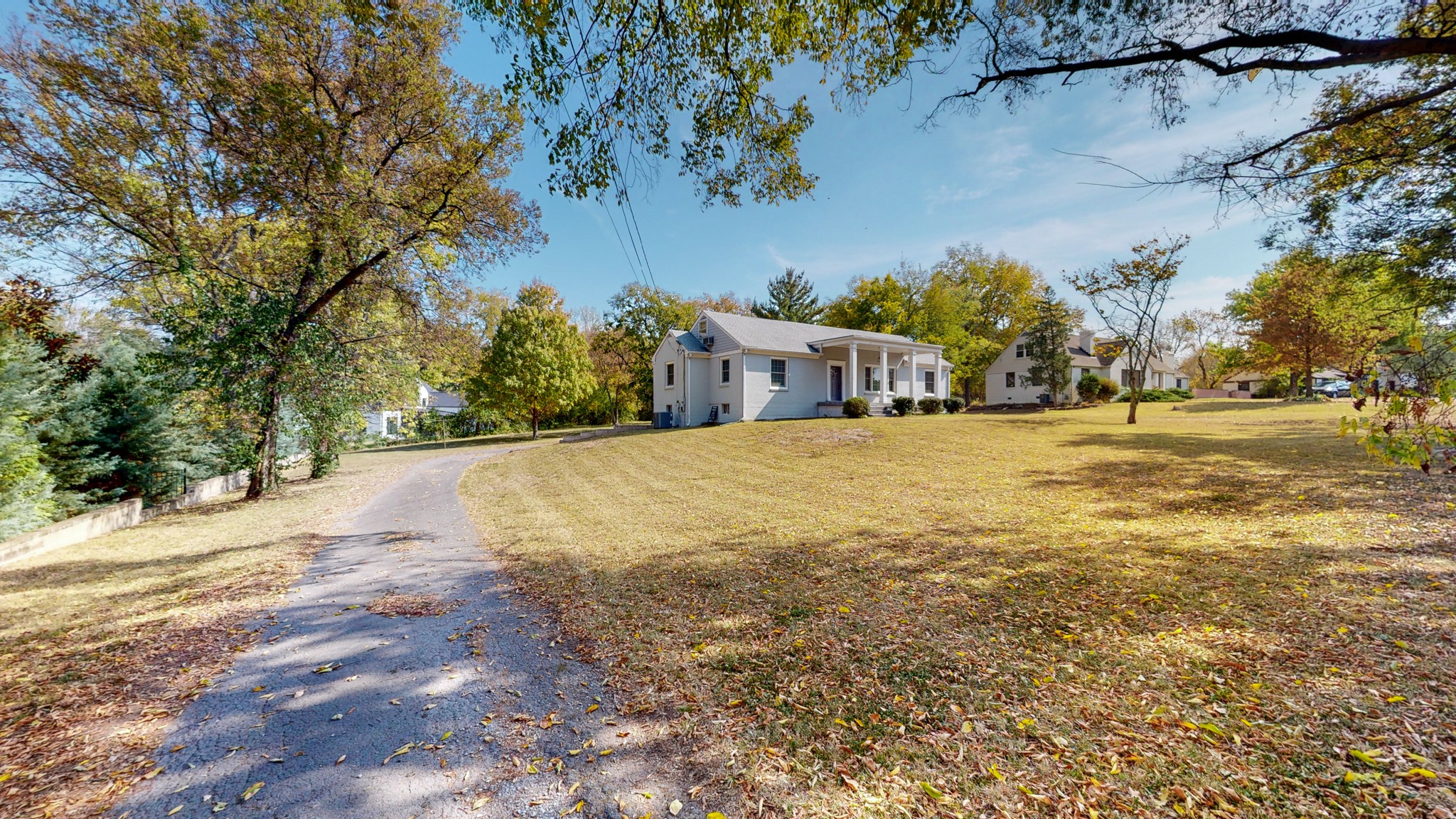 774 Elysian Fields Road Nashville, TN 37204 - Photo 8 of 43 a view of a large building with trees in the background
