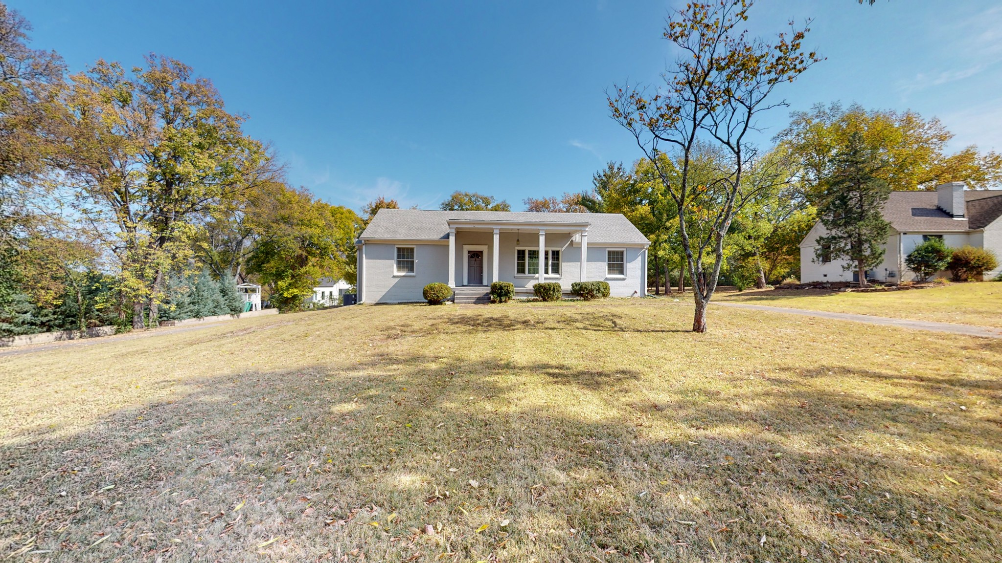 774 Elysian Fields Road Nashville, TN 37204 - Photo 9 of 43 a front view of a building with a yard