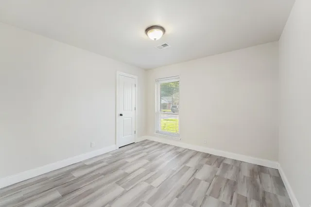 an empty room with window