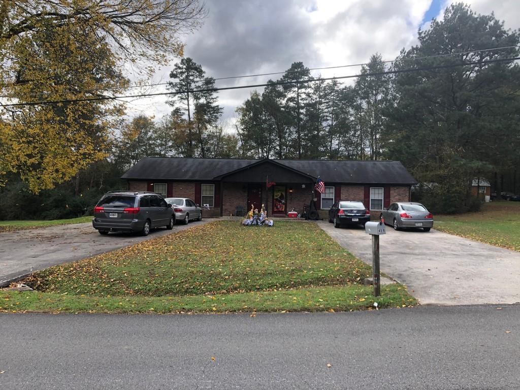 45 North N Ridge Rome, GA 30161 - Photo 1 of 1 a front view of a house with a garden and parking