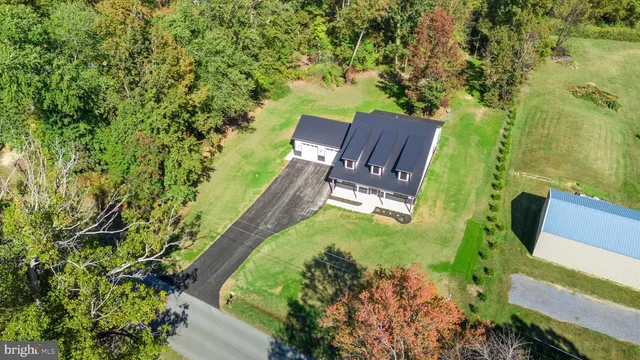 an aerial view of a garden with lawn chairs