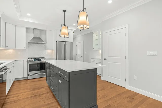 a kitchen with a stove a sink and a refrigerator