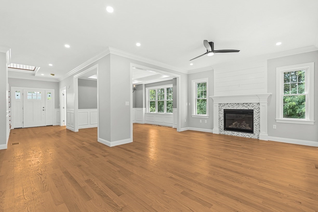 26 Flagg Street Woburn, MA 01801 - Photo 17 of 41 a view of an empty room with wooden floor fireplace and a window