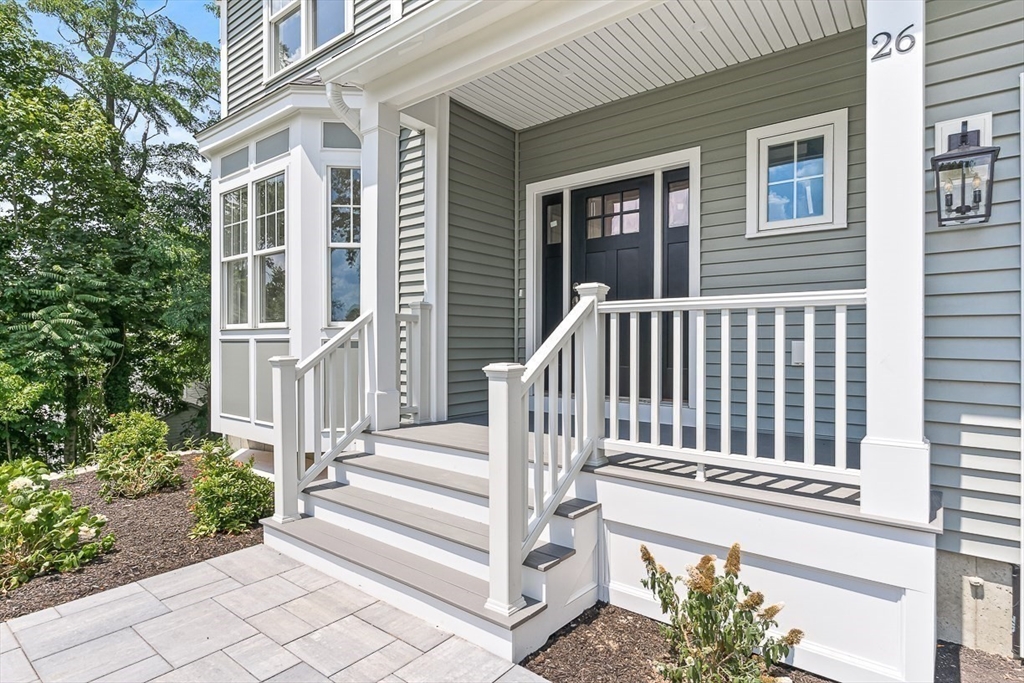 26 Flagg Street Woburn, MA 01801 - Photo 2 of 41 a view of a house with wooden fence