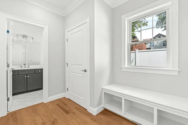 a room with a window and a view of bathroom