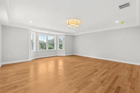 wooden floor in a room with a window