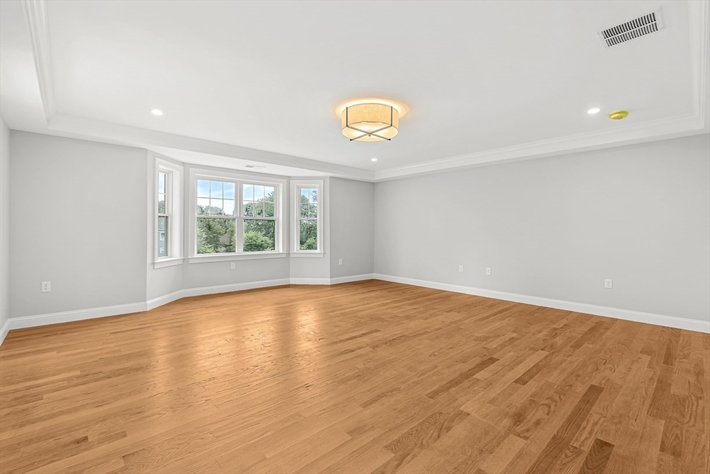 26 Flagg Street Woburn, MA 01801 - Photo 25 of 41 wooden floor in a room with a window