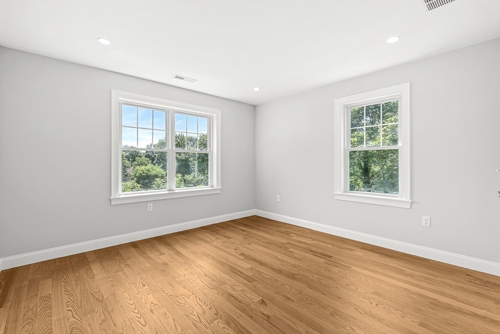 26 Flagg Street Woburn, MA 01801 - Photo 29 of 41 a view of an empty room with wooden floor and a window