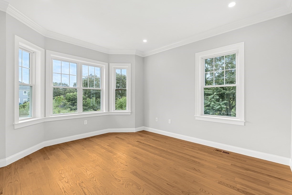 26 Flagg Street Woburn, MA 01801 - Photo 33 of 41 a view of an empty room with wooden floor and a window