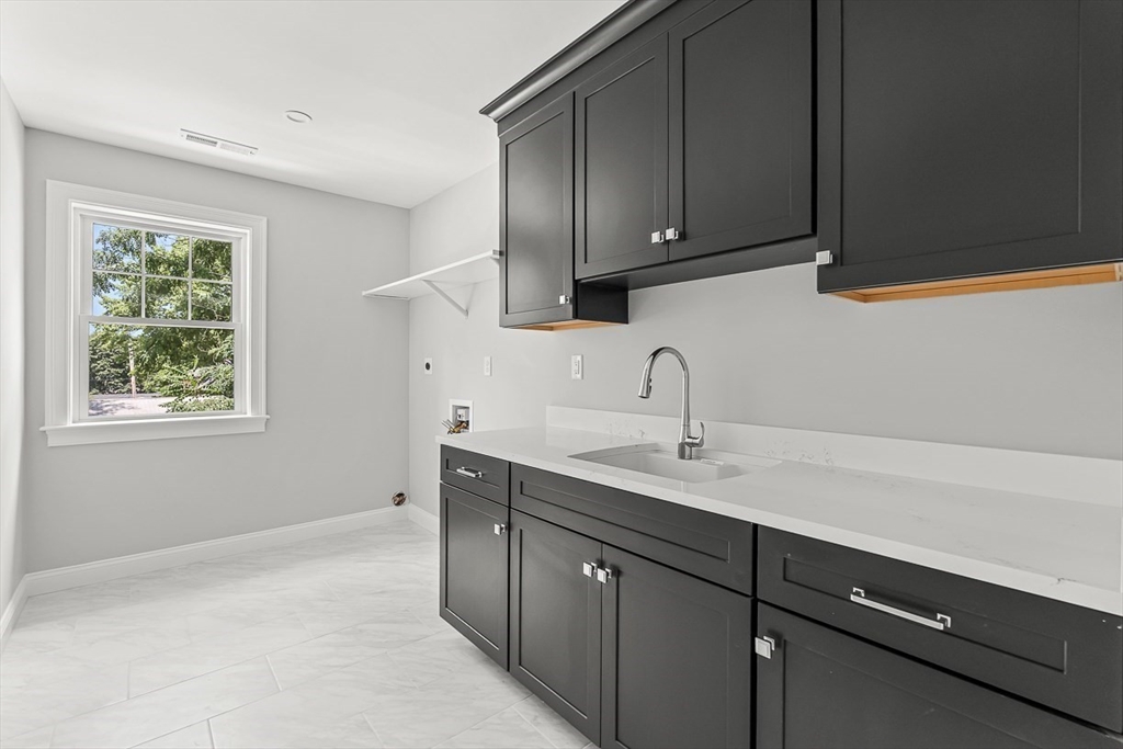 26 Flagg Street Woburn, MA 01801 - Photo 35 of 41 a kitchen with a sink cabinets and window
