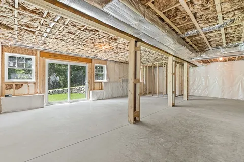 a view of an empty room with windows