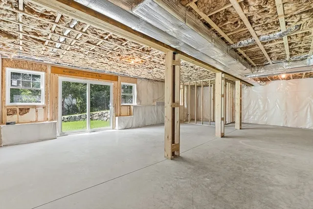 a view of an empty room with windows