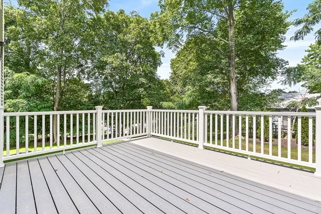 a view of balcony with wooden floor