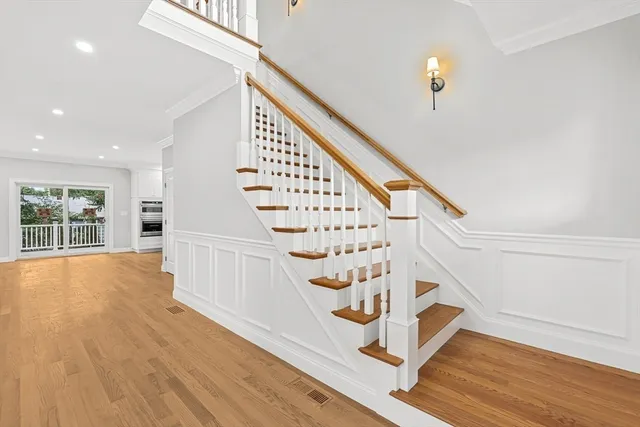 a view of an entryway with wooden floor