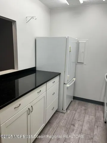 a view of a storage & utility room with two washing machine