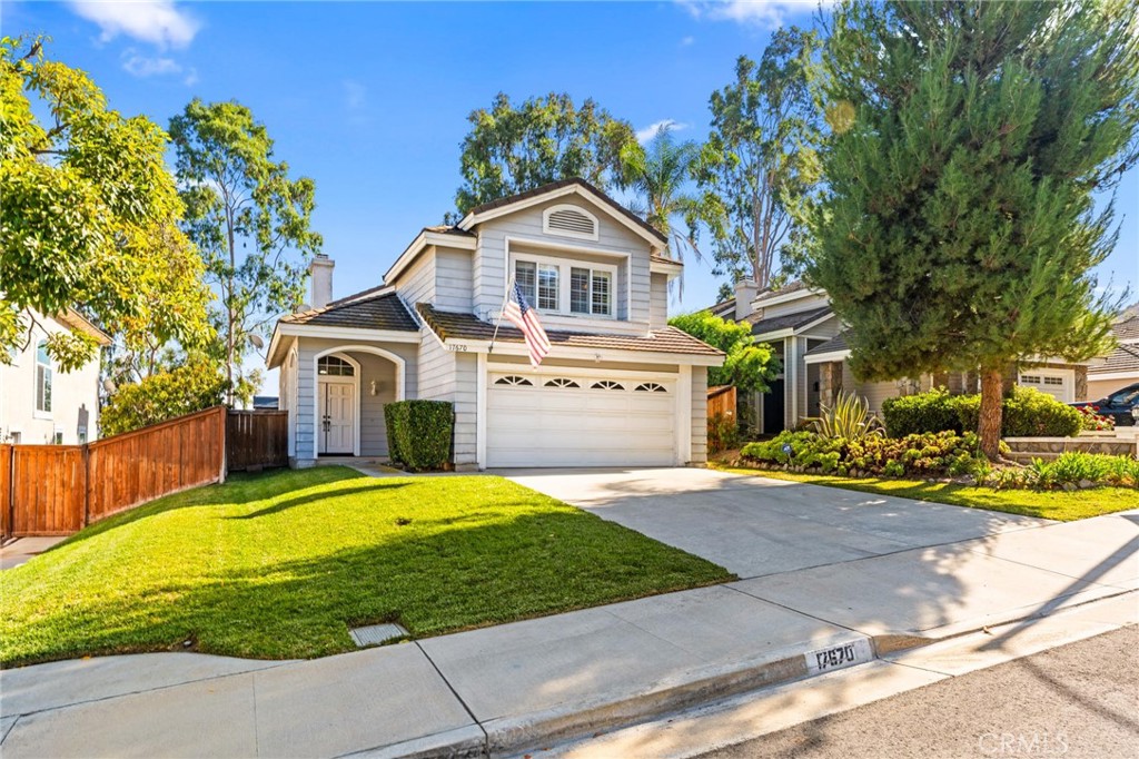 17670 Morning Sun Court Riverside, CA 92503 - Photo 1 of 1 a front view of a house with a yard and garage