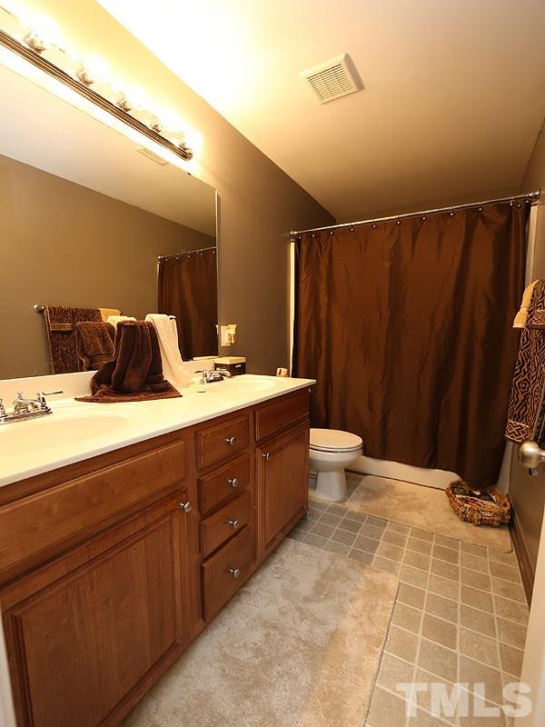 3907 Volkswalk Place Raleigh, NC 27610 - Photo 8 of 13 Garden tub and dual vanity in master bathroom.