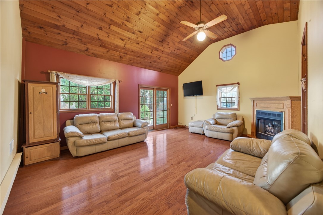 2983 Wood Road Milo, NY 14842 - Photo 28 of 48 Large family room with gas fireplace and slider to