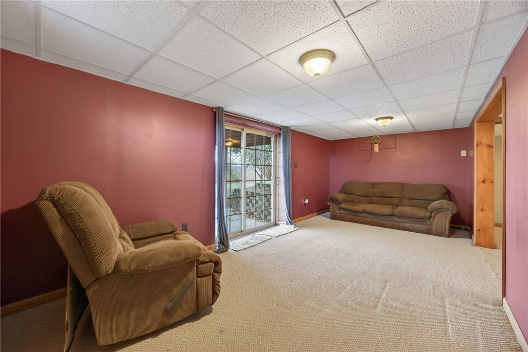 2983 Wood Road Milo, NY 14842 - Photo 37 of 48 Lower level living room with sliders to patio.