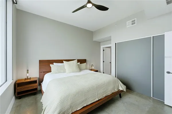 a bedroom with a bed and a dresser